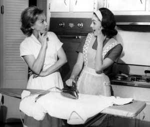 women_talking over ironing board